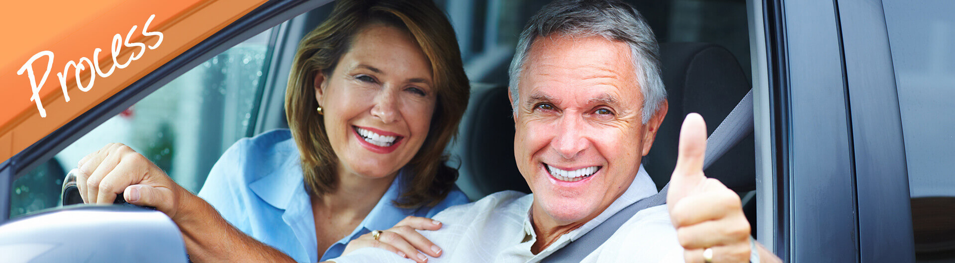 Our Process Banner - Older Couple Giving Thumbs Up From Inside a Car